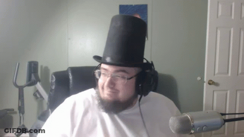 Man In Top Hat And Headphones At Microphone GIF