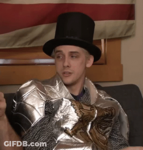 Man In Top Hat And Knight's Armor Sitting On Couch GIF