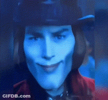 Man In Top Hat And Purple Suit Talking To Another Man GIF