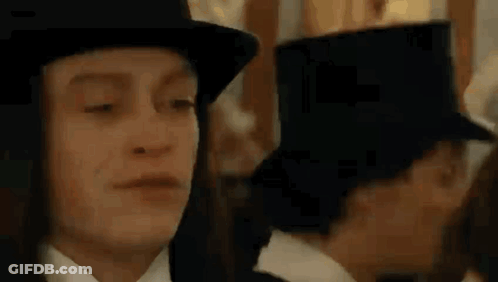 Man In Top Hat And Woman In Tuxedo GIF