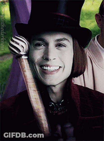 Man In Top Hat Holding Cane Smiles GIF