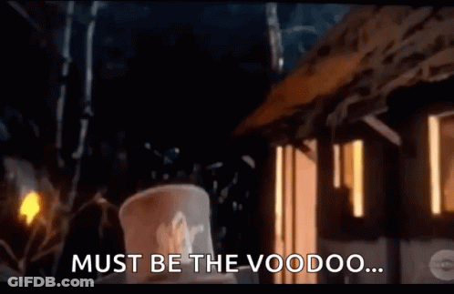 Man In Top Hat In Front Of Voodoo Building GIF