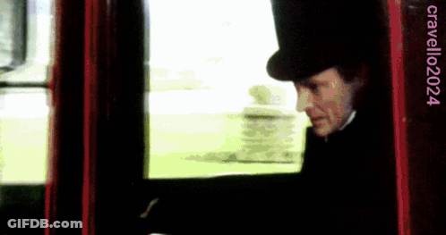 Man In Top Hat Looking Out Window Cradillo2024 GIF