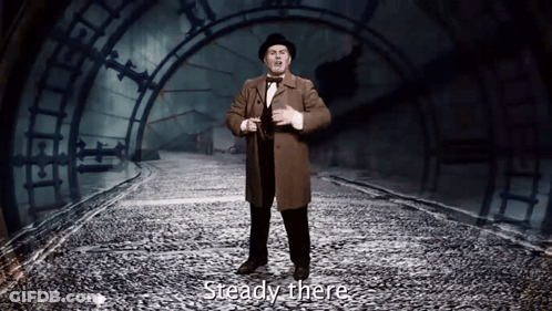 Man In Top Hat Saying Steady There GIF
