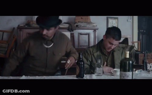 Man In Top Hat Sitting At Table With Alcohol GIF
