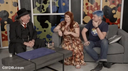 Man In Top Hat Sitting Next To Woman And Blue-Haired Man GIF