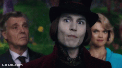 Man In Top Hat Smiling In Front Of Group GIF