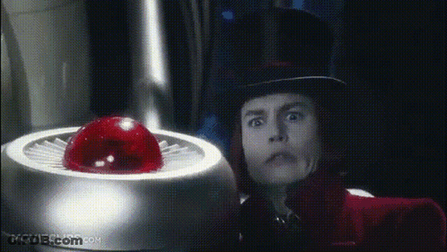 Man In Top Hat Standing Before Movieclips.com Button GIF