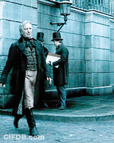 Man In Top Hat Walking Down Sidewalk GIF