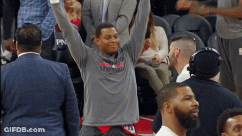 Man In Toronto Basketball Shirt Raising Arms GIF