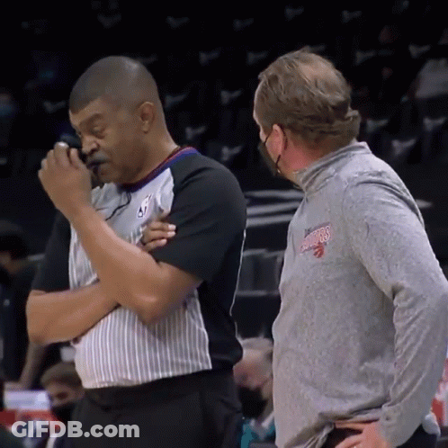 Man In Toronto Raptors Shirt Talking To Another Man GIF