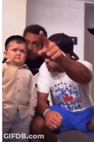 Man In Toronto Star T-Shirt Holding Baby GIF