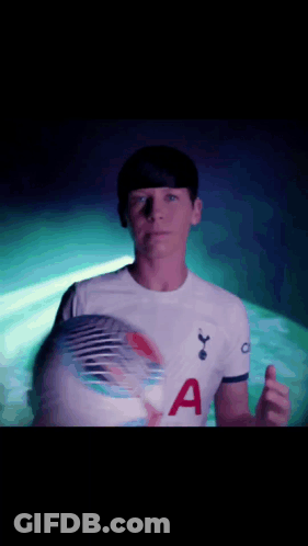Man In Tottenham Shirt Holding Soccer Ball GIF