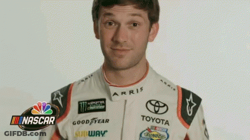 Man In Toyota Racing Suit Making A Face GIF