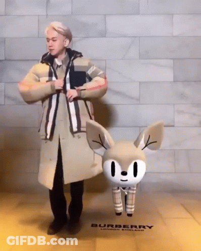 Man In Trench Coat And Cartoon Deer Burberry Store GIF