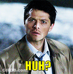 Man In Trench Coat And Tie With Huh On Face GIF