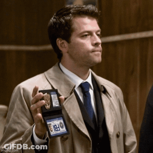 Man In Trench Coat Holding FBI Badge GIF