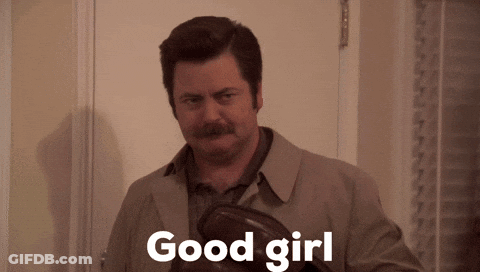 Man In Trench Coat Holding Shoes GIF