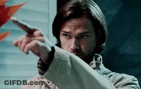 Man In Trench Coat Pointing GIF