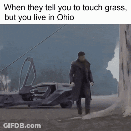 Man In Trench Coat Walking In Front Of Car When They Tell You To Touch Grass GIF