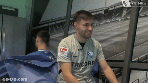 Man In Tricorp Workwear Shirt Sitting In Room GIF