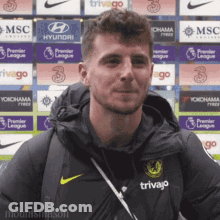 Man In Trivago Jacket Smiling Before Ads GIF