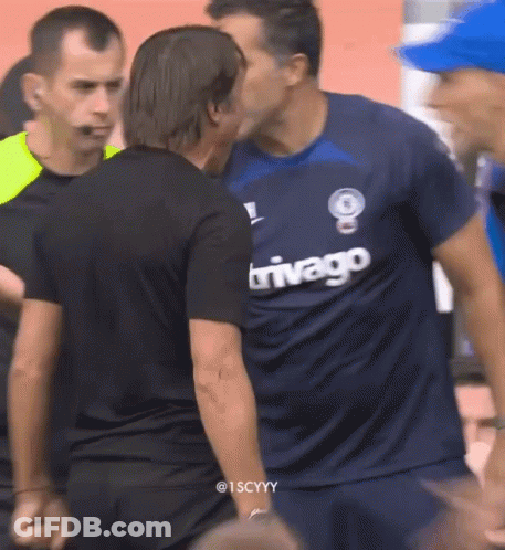 Man In Trivago Jersey Kissing Another Man GIF