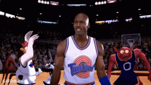 Man In Tune Squad Jersey On Basketball Court With Cartoon Characters GIF