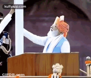 Man In Turban Giving Speech At Podium GIF