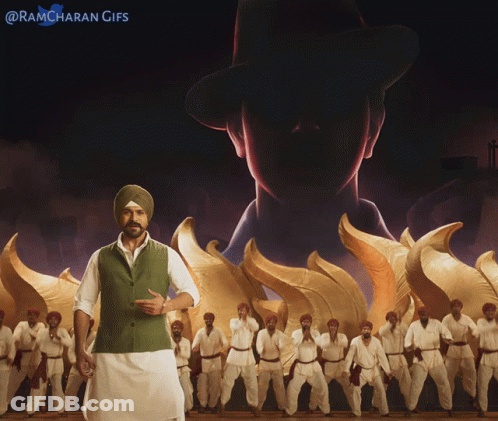 Man In Turban In Front Of Men In White Pants GIF