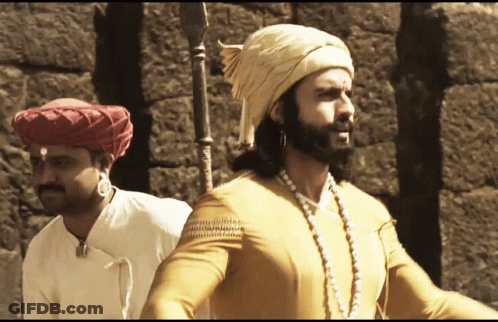 Man In Turban Next To Man In Yellow Shirt GIF