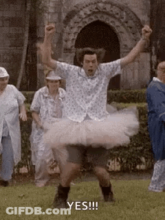 Man In Tutu Dancing In Field GIF