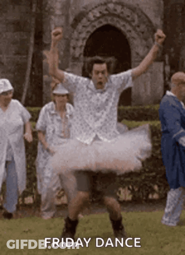 Man In Tutu Dancing In Field With Group GIF