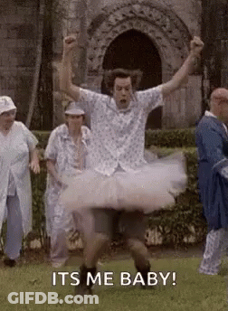 Man In Tutu Jumping As People Watch GIF