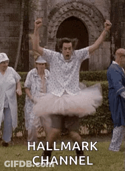 Man In Tutu Jumping Before Group GIF