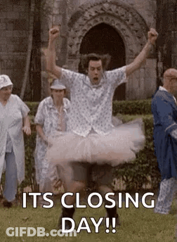 Man In Tutu Jumping Behind Group Of People GIF