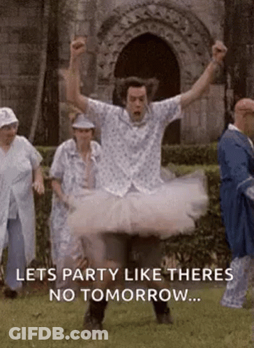 Man In Tutu Jumping In Air With Group Behind GIF