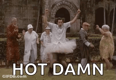 Man In Tutu Jumping While Dancing With Elderly People GIF