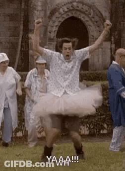 Man In Tutu Jumping While People Watch GIF