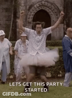 Man In Tutu Jumping While People Watch GIF