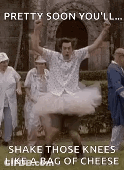 Man In Tutu Jumping While People Watch GIF