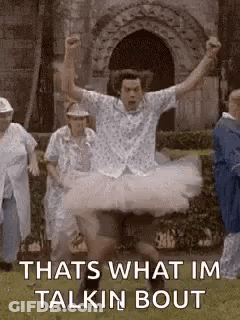Man In Tutu Jumping While People Watch GIF