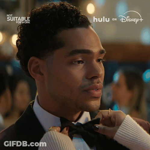 Man In Tuxedo Adjusted By Woman With Hulu On Disney GIF
