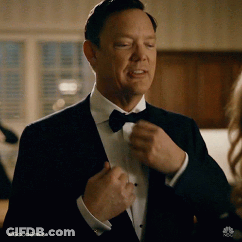 Man In Tuxedo Adjusting Bow Tie GIF