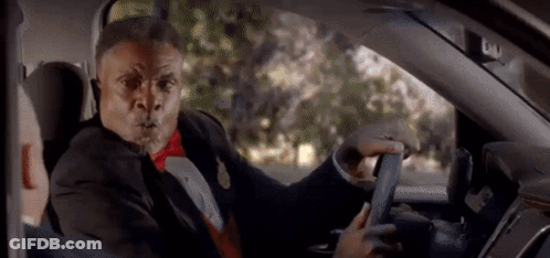 Man In Tuxedo And Bow Tie Driving Car Funny Face GIF