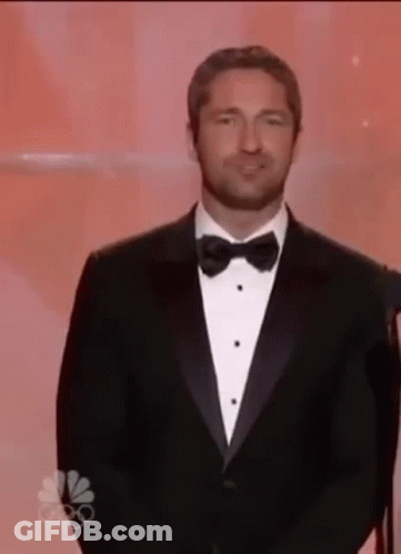 Man In Tuxedo And Bow Tie Giving Speech GIF