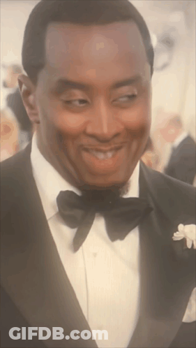 Man In Tuxedo And Bow Tie Looking GIF
