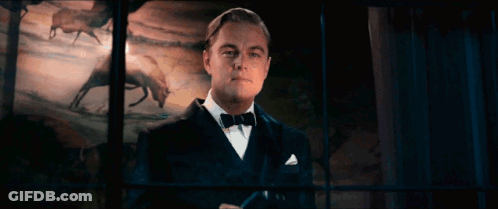 Man In Tuxedo And Bow Tie Looking Out Window GIF
