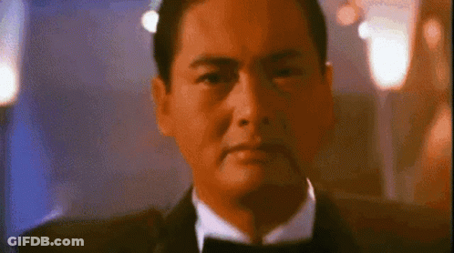 Man In Tuxedo And Bow Tie Looking Serious GIF