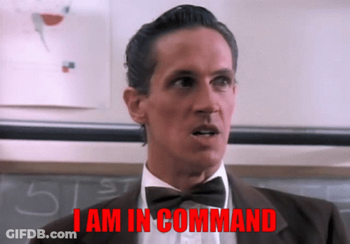 Man In Tuxedo And Bow Tie Saying I Am In Command GIF